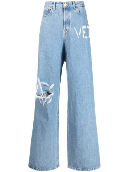 VETEMENTS logo-distressed baggy jeans